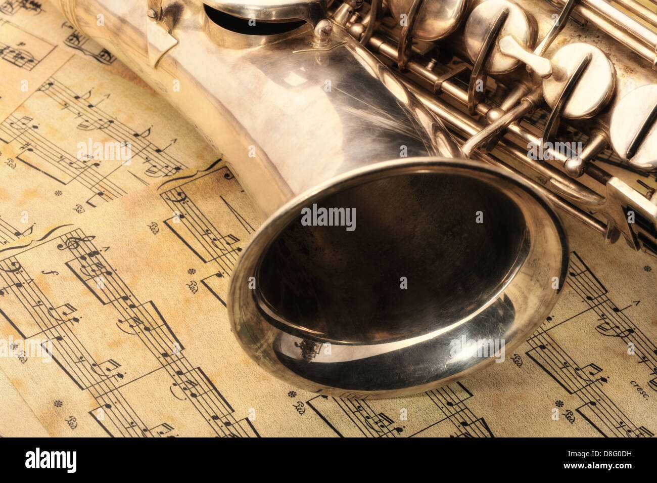 Old saxophone and notes Stock Photo