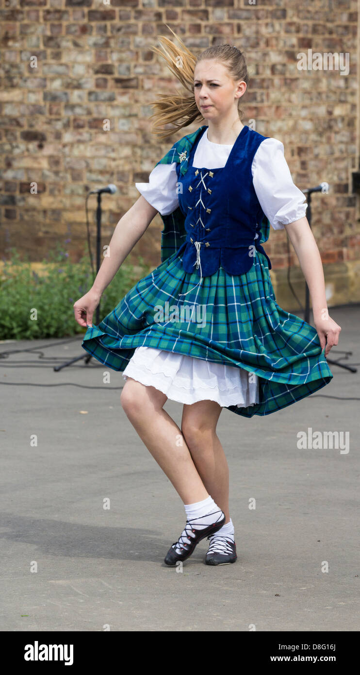 Highland dancer at folk festival. UK Stock Photo