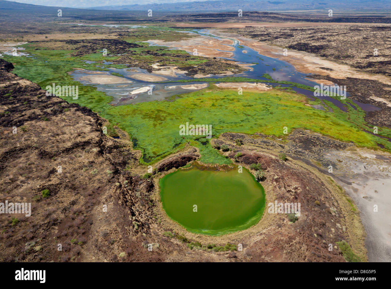 Crater lake adjacent to the Suguta river. Great Rift Valley. Kenya Stock Photo