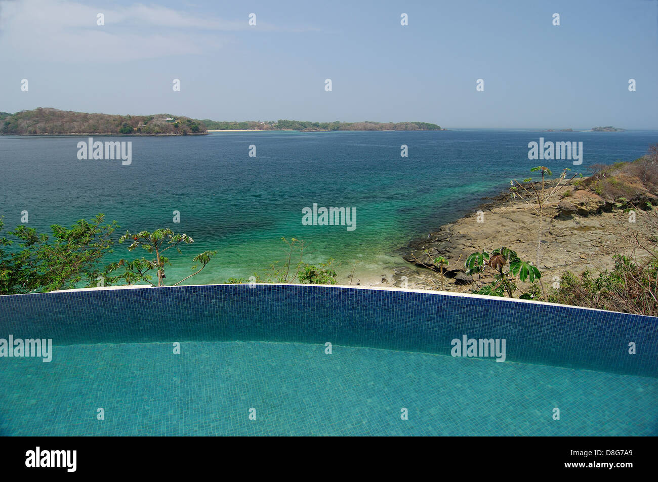 Swimming pool border facing the shore at Contadora island Stock Photo