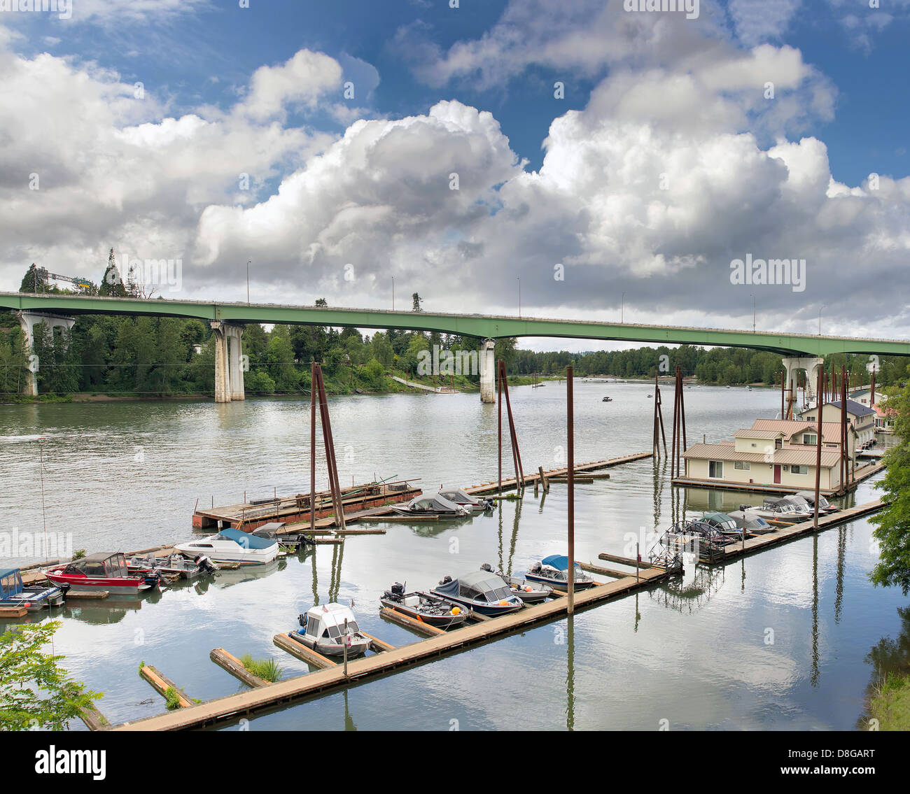 Boat Moorage Along Willamette River in Oregon City with I-205 Freeway on George Abernethy Bridge Stock Photo