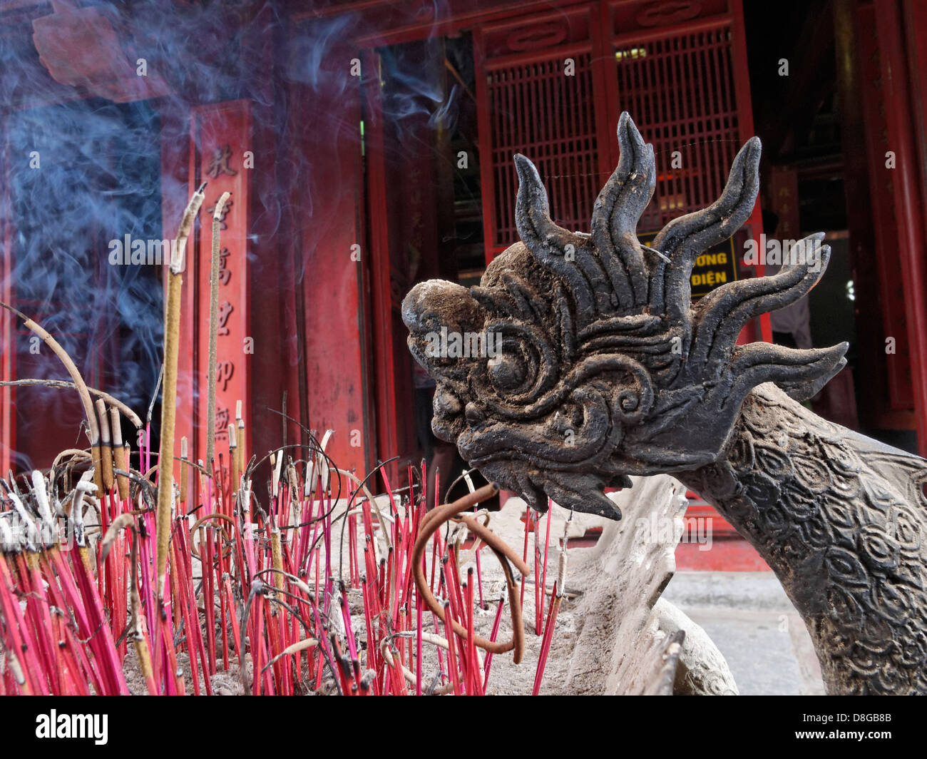 Burning incense at the Temple of Literature, Hanoi, Vietnam. Stock Photo