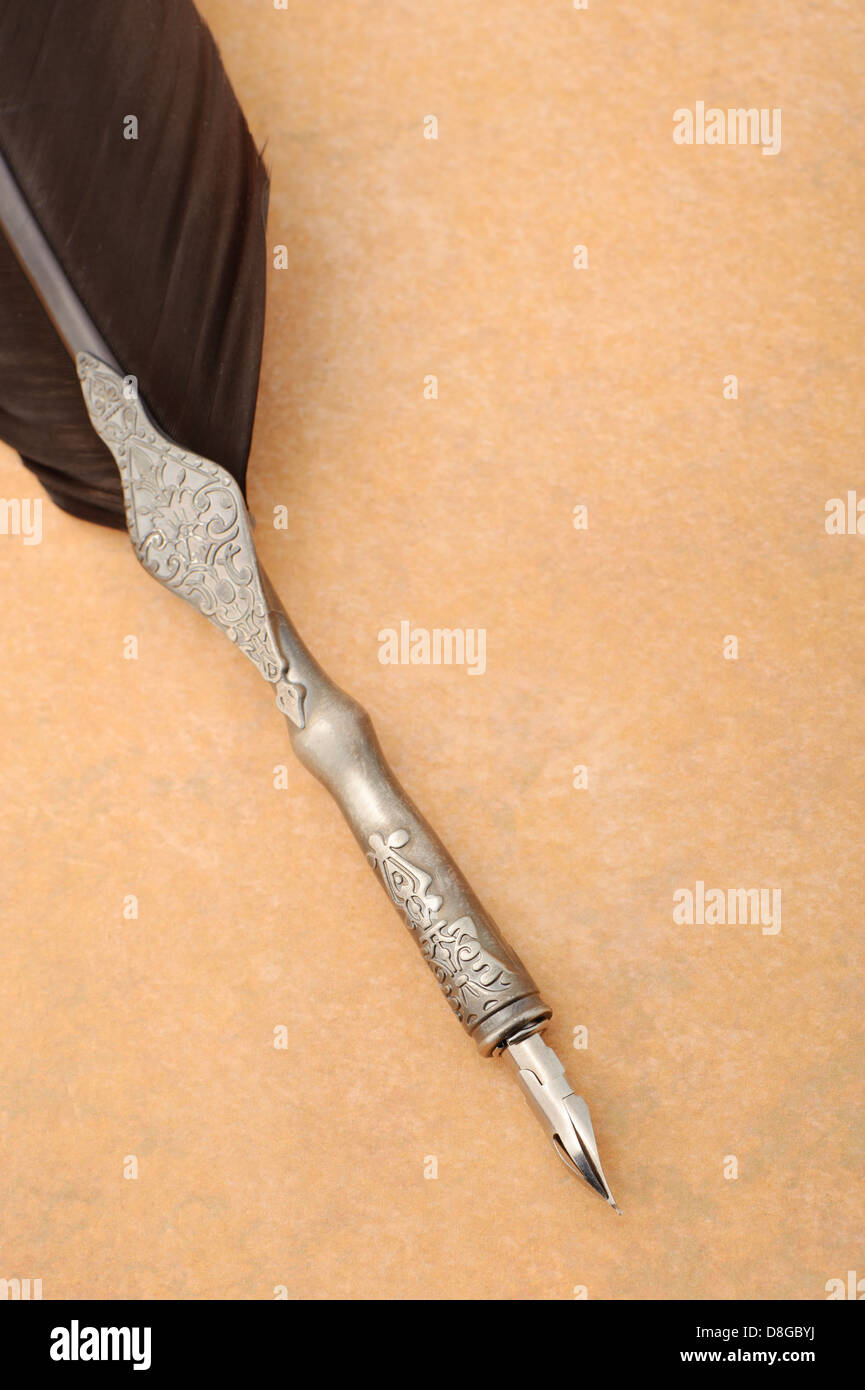 Feather quill an old paper Stock Photo - Alamy