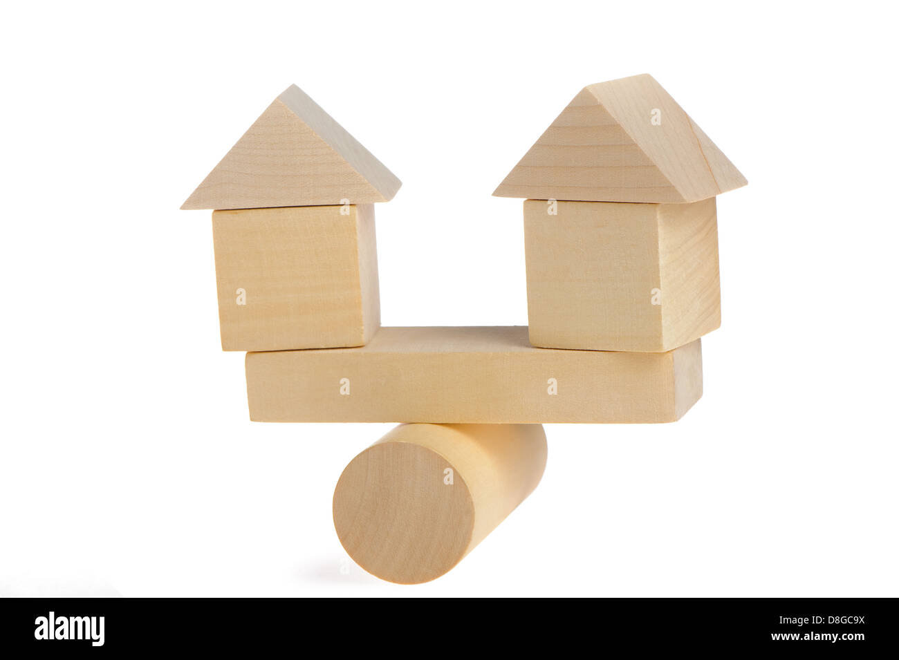 Wooden houses on abstract scales Stock Photo Alamy