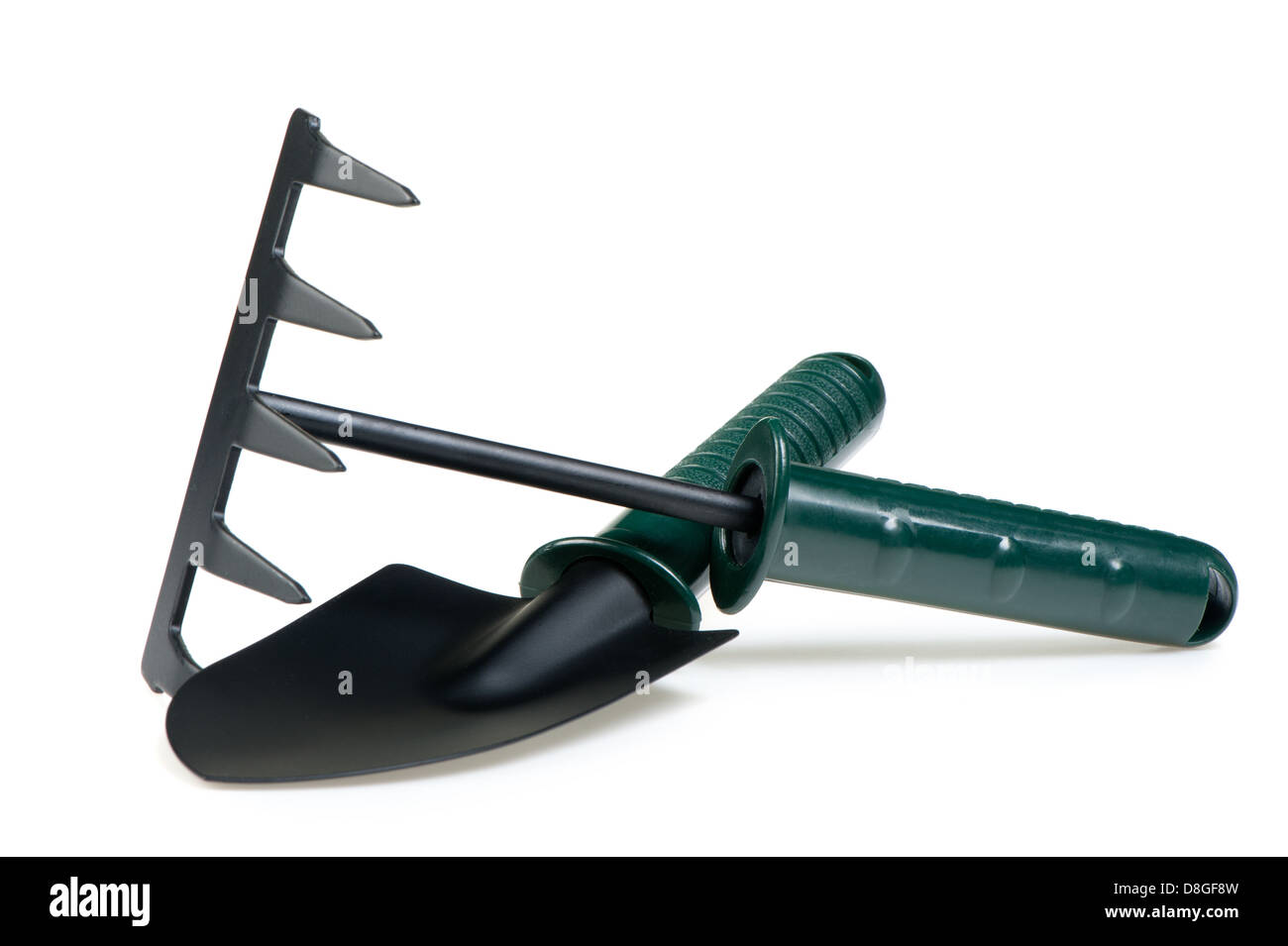 The garden tool a shovel, a rake. Stock Photo