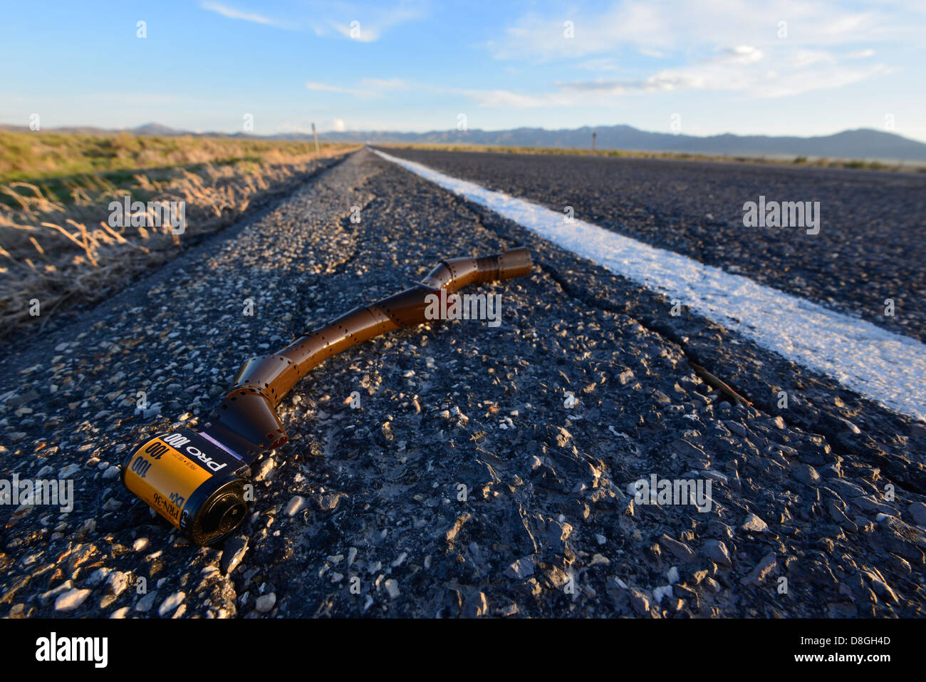 Discarded roll of film along the side of highway in the Great Basin region of Utah. Stock Photo