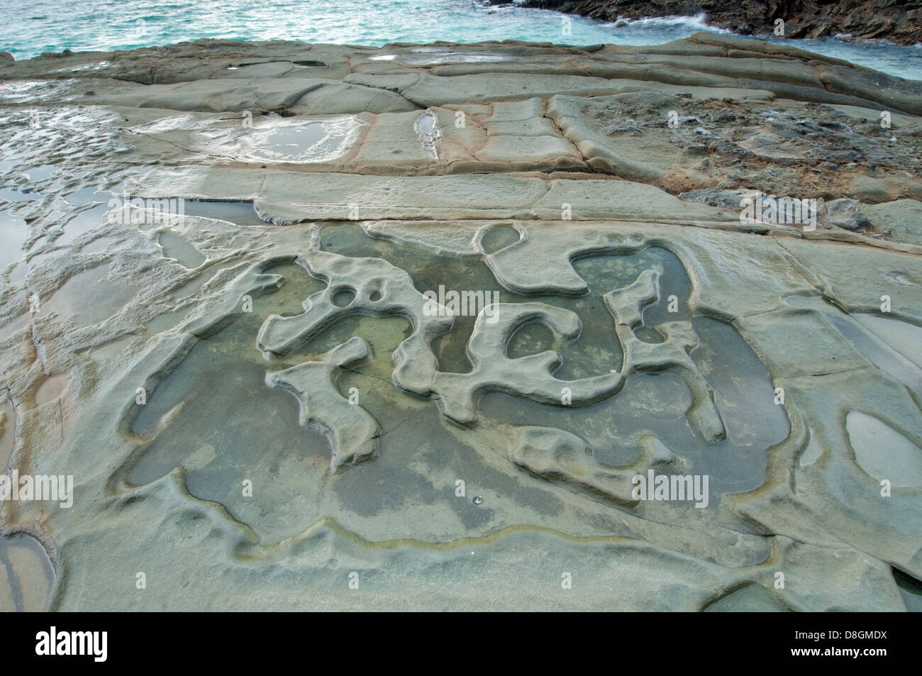 Water pools formed at low tide in Isla Pacheca shore Stock Photo