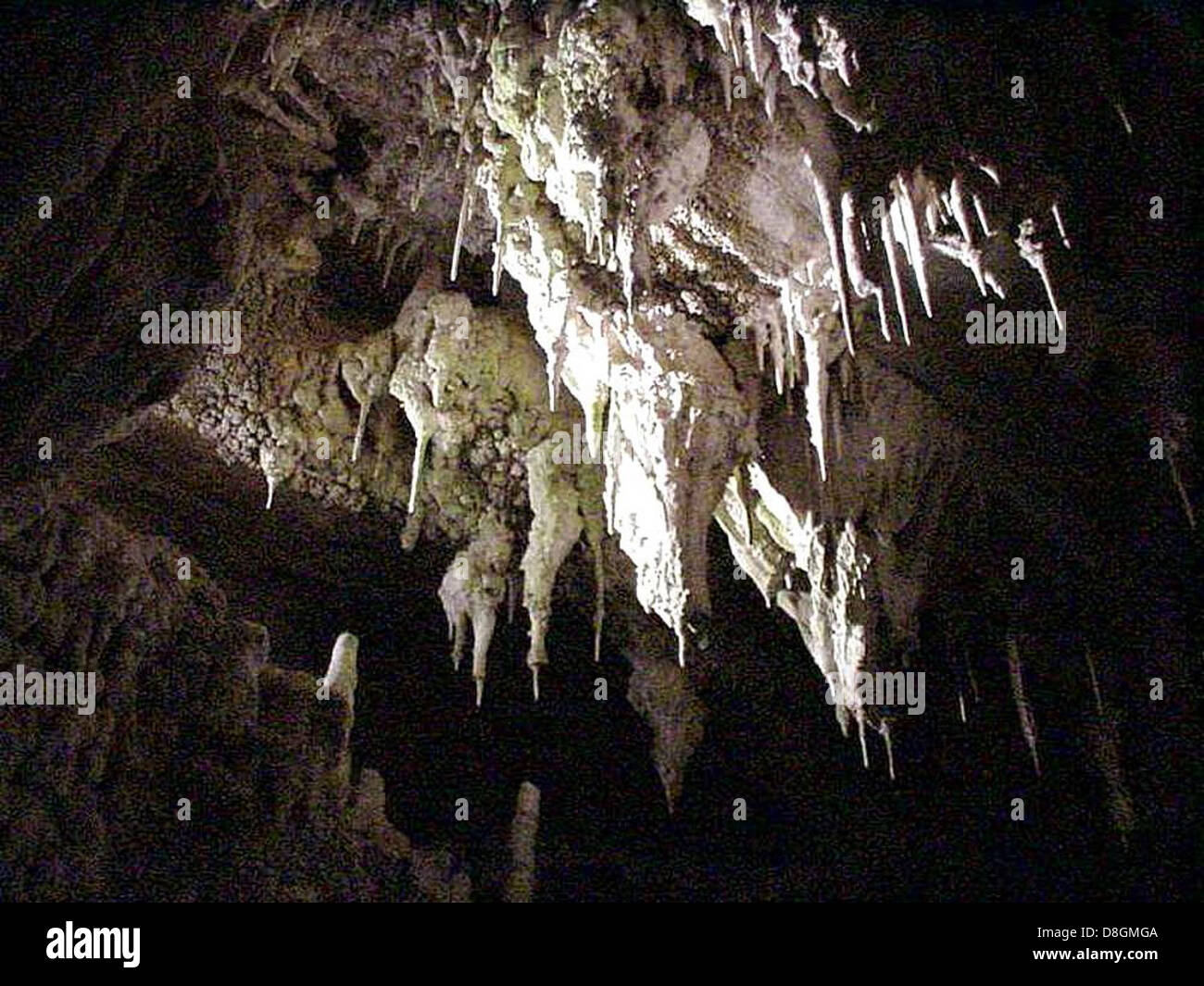 A stunning crystal cave filled with large, shimmering crystals. The ...