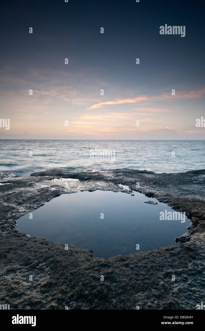 Water pool formed at low tide in Isla Pacheca shore Stock Photo
