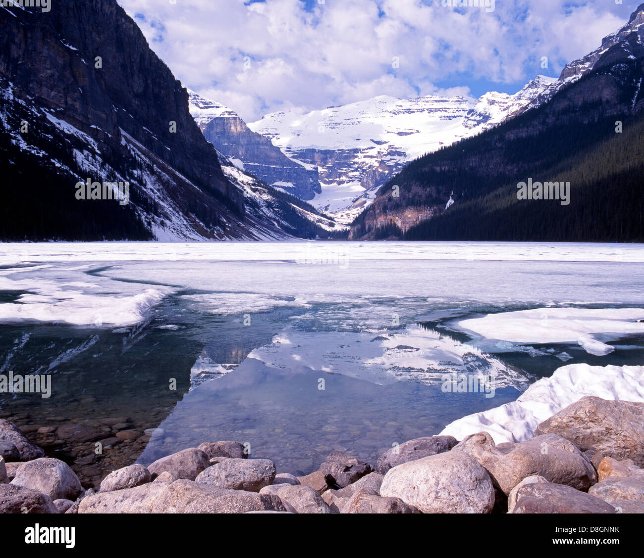 View of a partly frozen Lake Louise, Alberta, Canada Stock Photo - Alamy