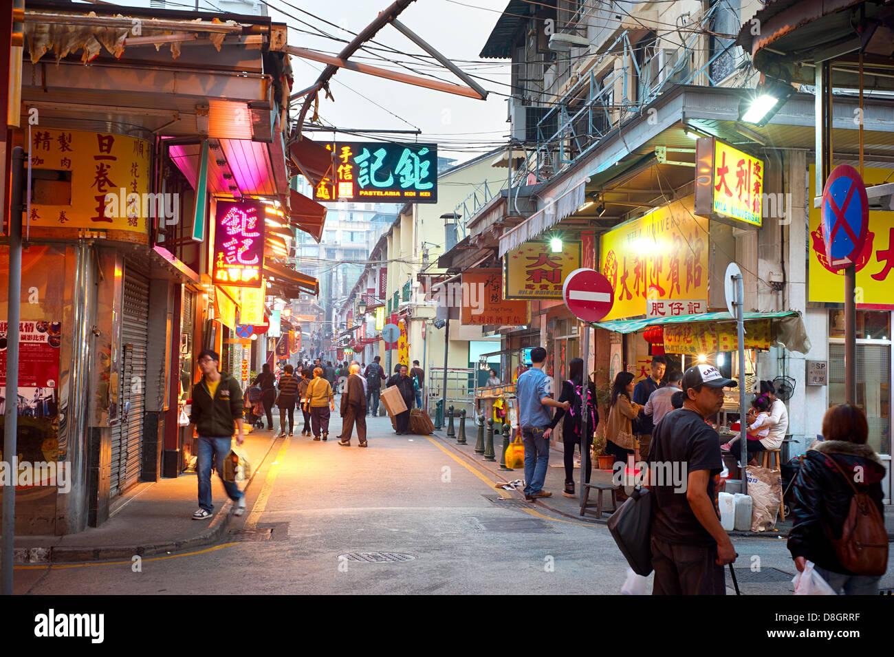 People walking on downtown street in Macau. Stock Photo