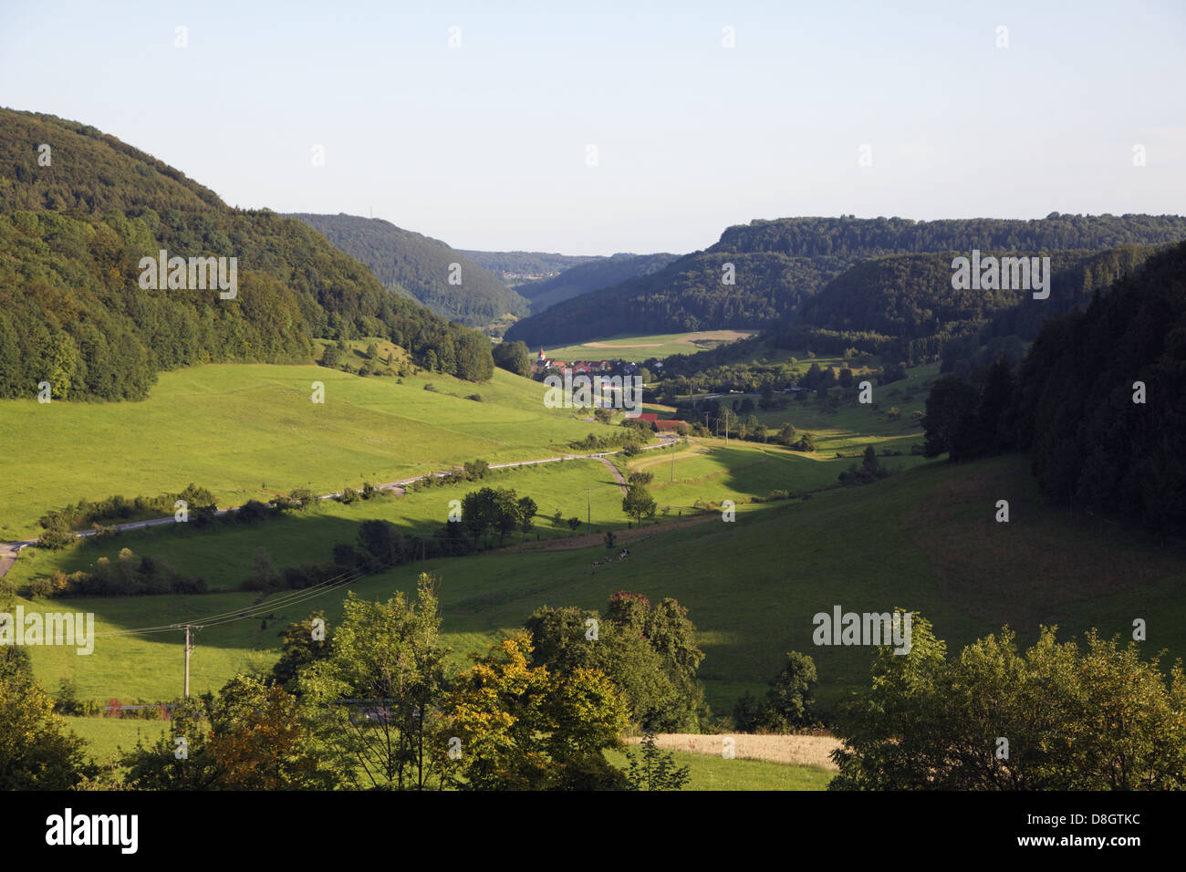 Germany, Baden-Württemberg, Swabian Alb (mountains), epee field, village, street, point of view Stock Photo