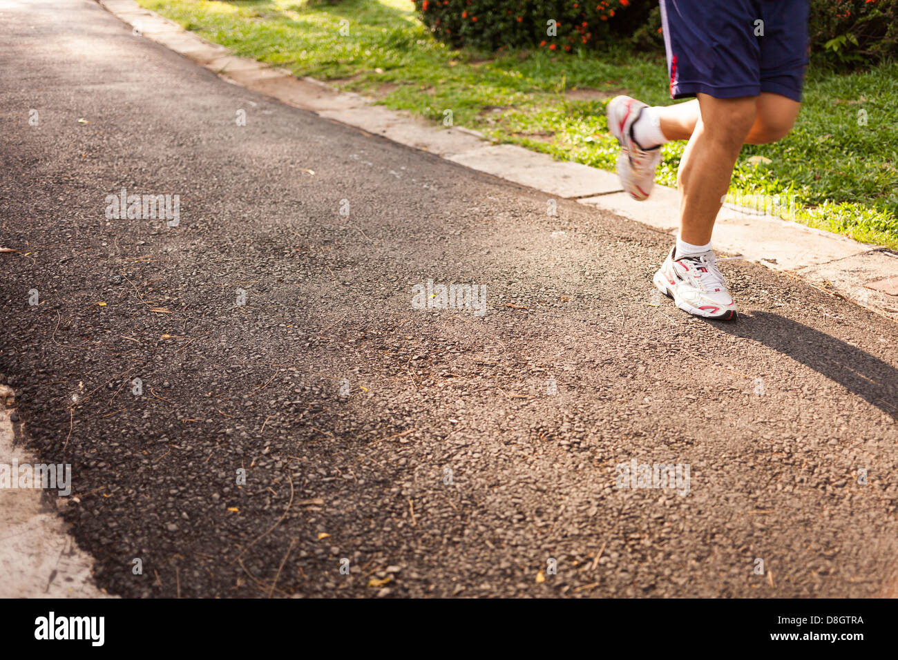 man running jogging on street in park Stock Photo Alamy