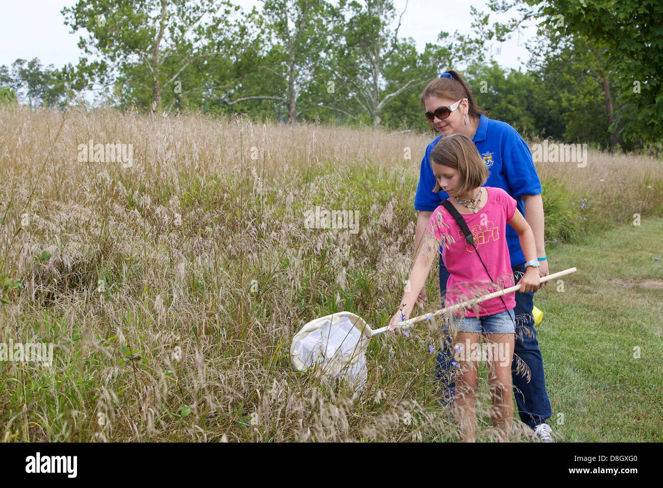 A child is shown with a butterfly net, learning how to catch insects in ...