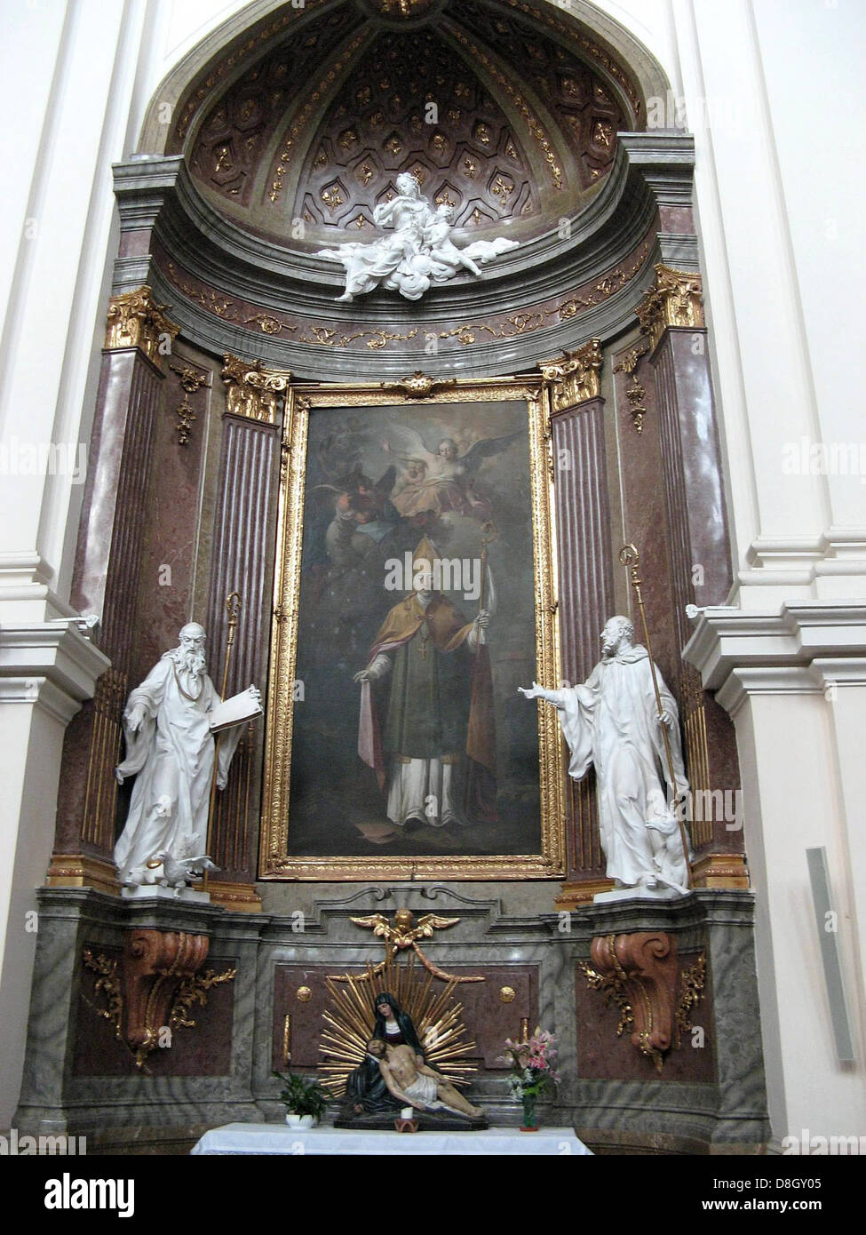 A photograph of the interior of a church, showcasing religious statues ...