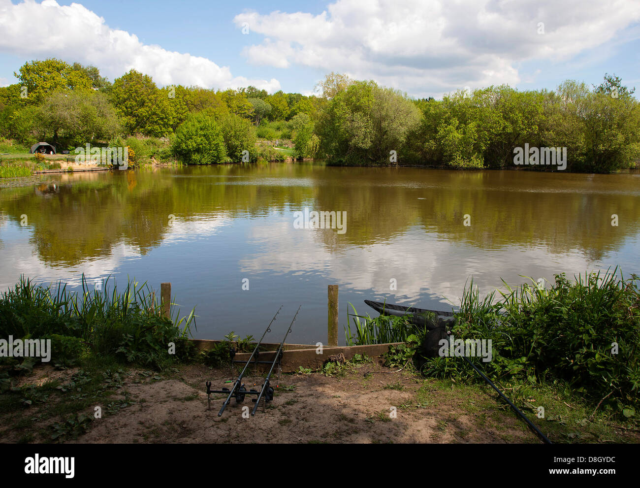 A Sussex lake with fishing rods Stock Photo