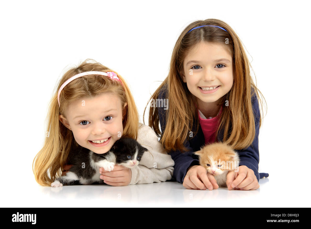 Beautiful young girls posing with lovely young kittens Stock Photo - Alamy