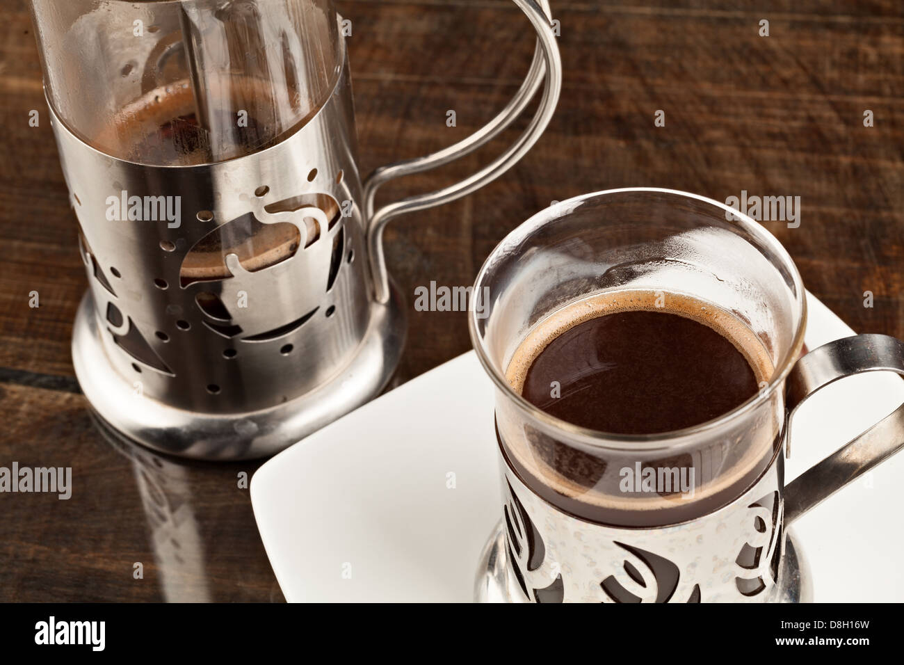 Elegant Coffee Cup Served Along With Filter Against Heavy Polished Wood Table Stock Photo Alamy