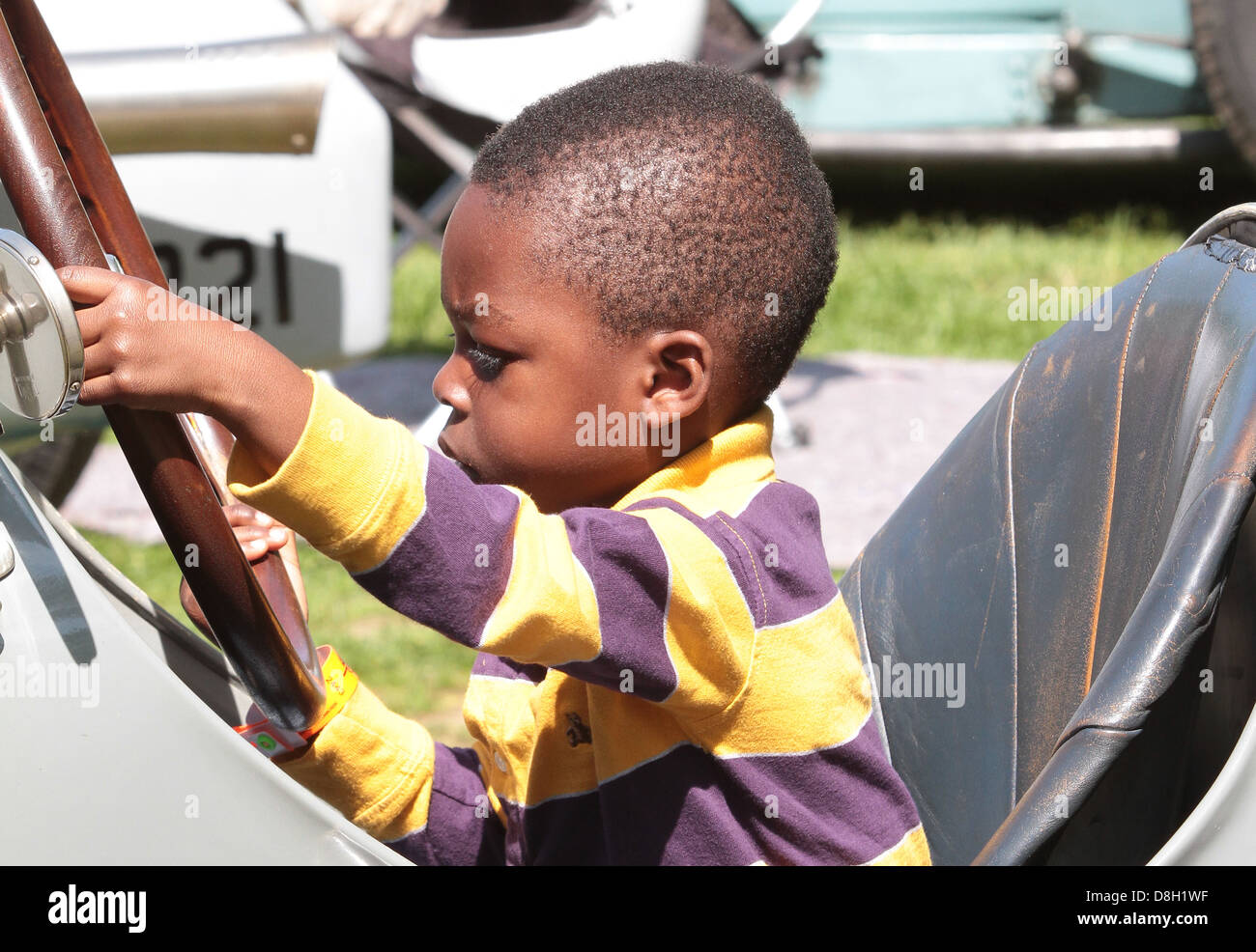 boy playing in 1929 Amilcar Stock Photo