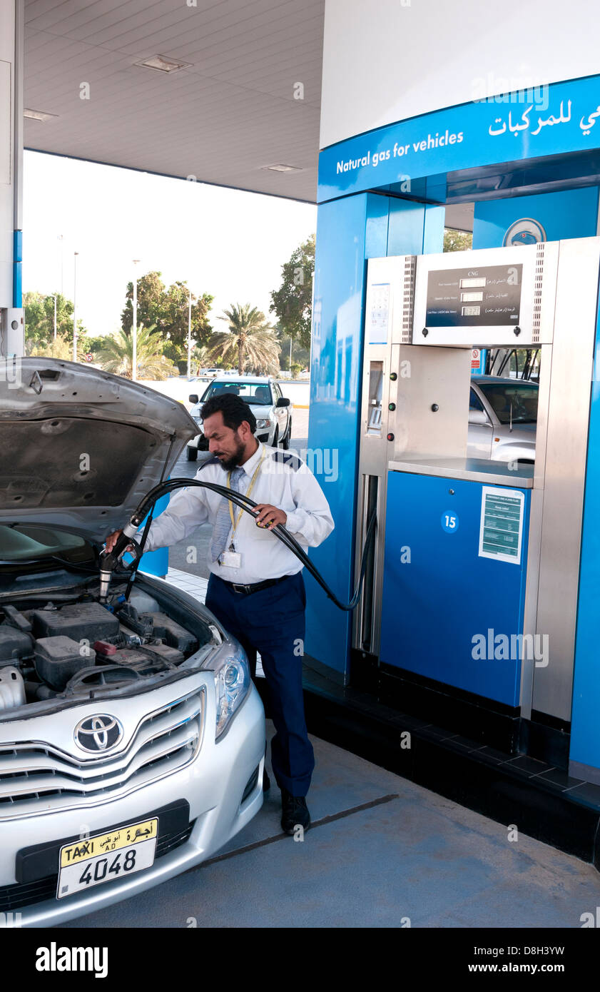 Taxi getting modern Natural Gas in auto at station for green world in