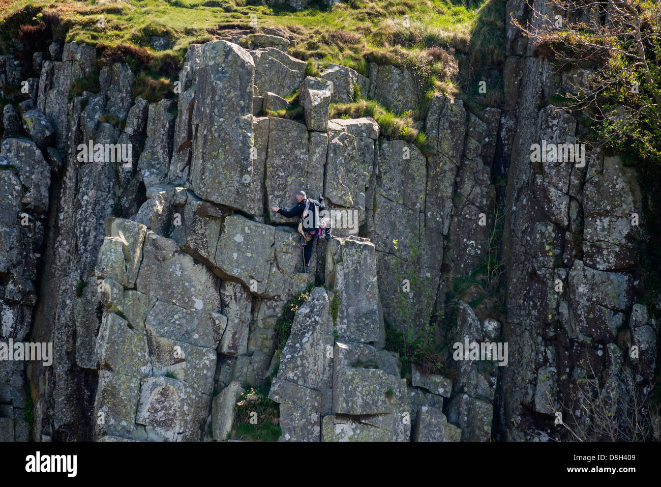 Rock Climber on Peel Crag in Northumberland Stock Photo