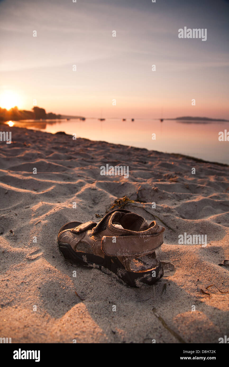 Sandals on the beach Stock Photo - Alamy