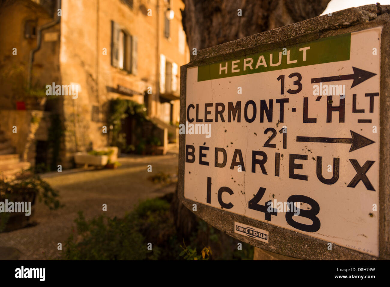 Old road sign for directions to Clermontl'Hérault and Bedarieux