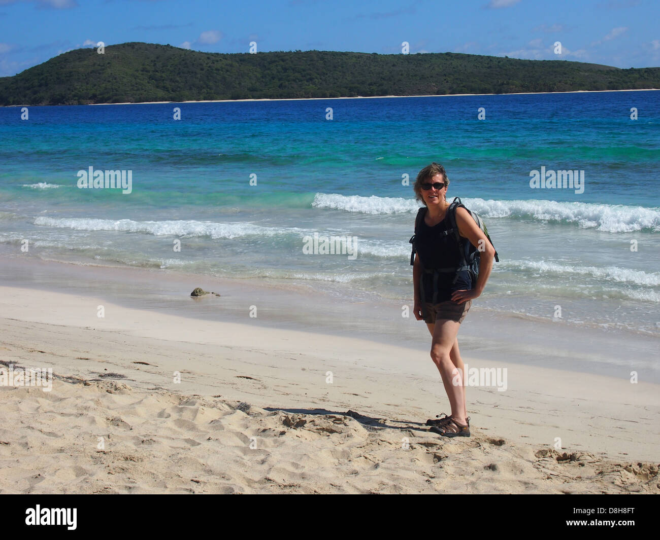 Woman on Caribbean sand beach Stock Photo
