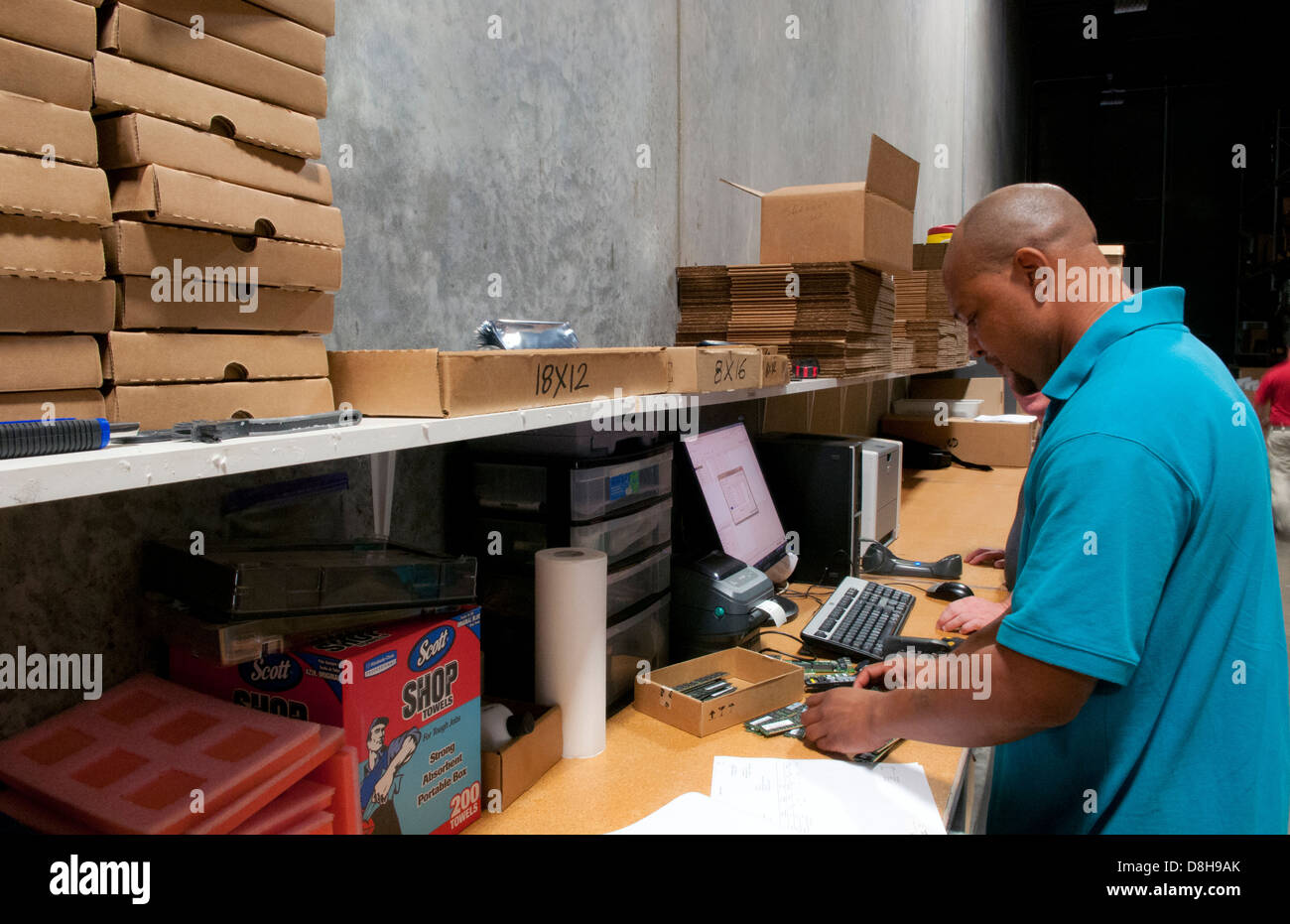 african american man shipping computer technology IT company shipping inventory Stock Photo