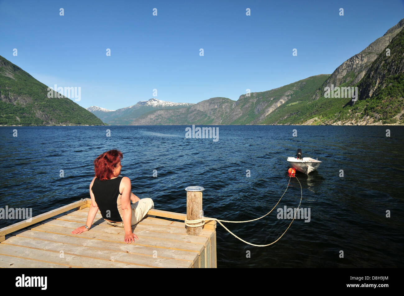 Woman on the fjord Stock Photo