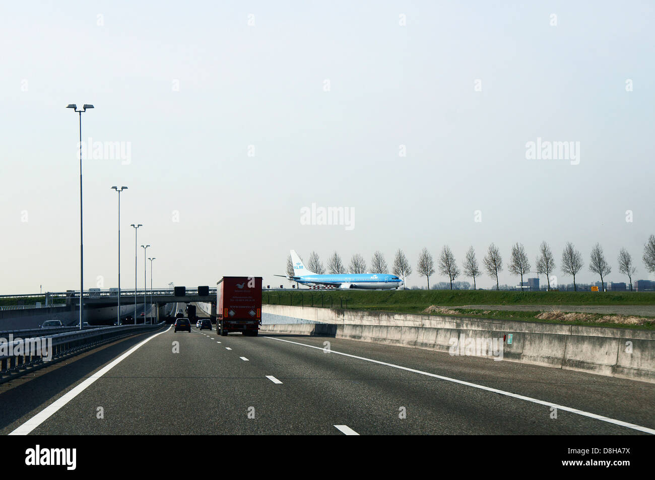 Dutch airline KLM plane cross A5 motorway at Amsterdam's Schiphol ...