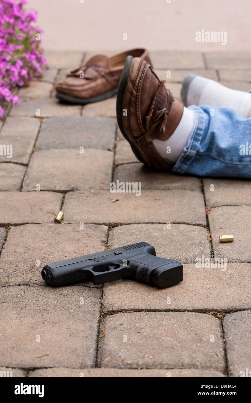 Gun and Body at Murder Site Stock Photo