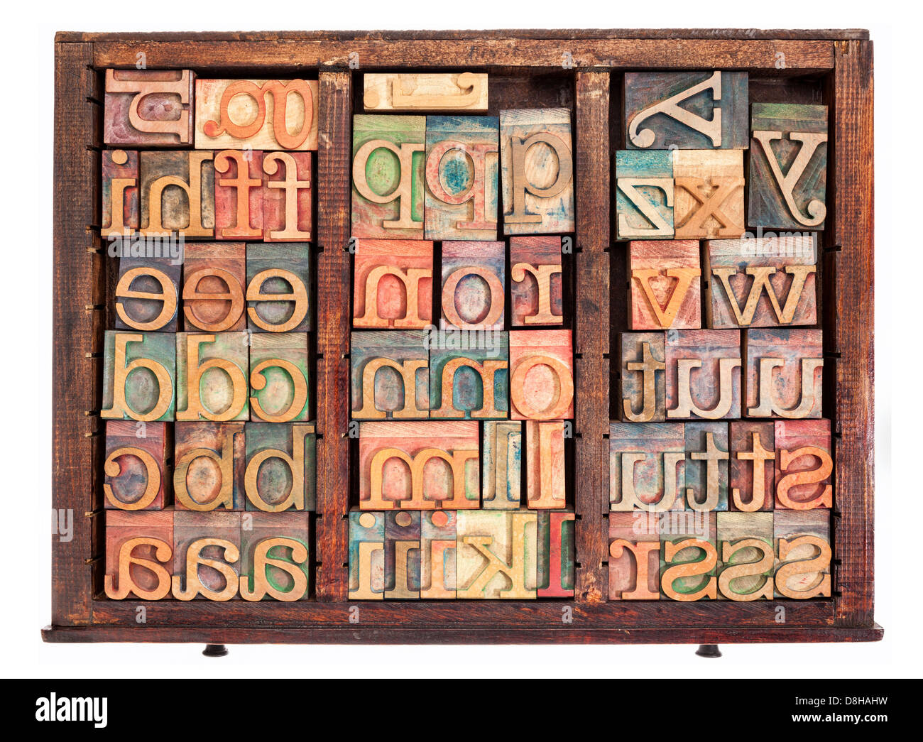 alphabet letterpress wood type printing blocks in old typesetter drawer isolated on white