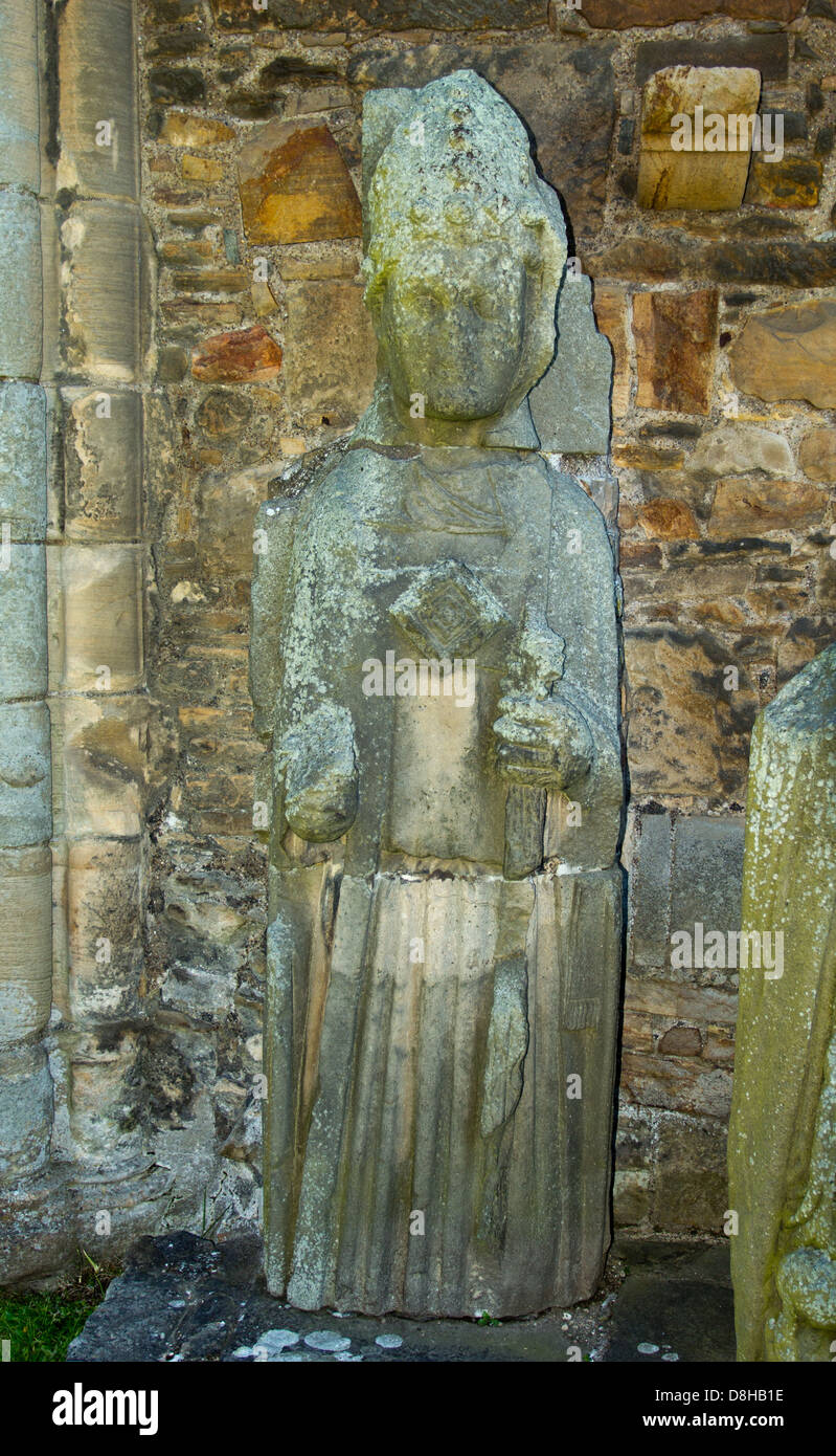 A STONE STATUE STANDING OUTSIDE THE CATHEDRAL IN ELGIN SCOTLAND Stock Photo