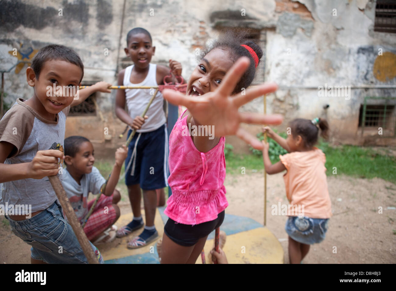 Children in Havana, Cuba playing on playground, exuding vibrant joy. Stock Photo