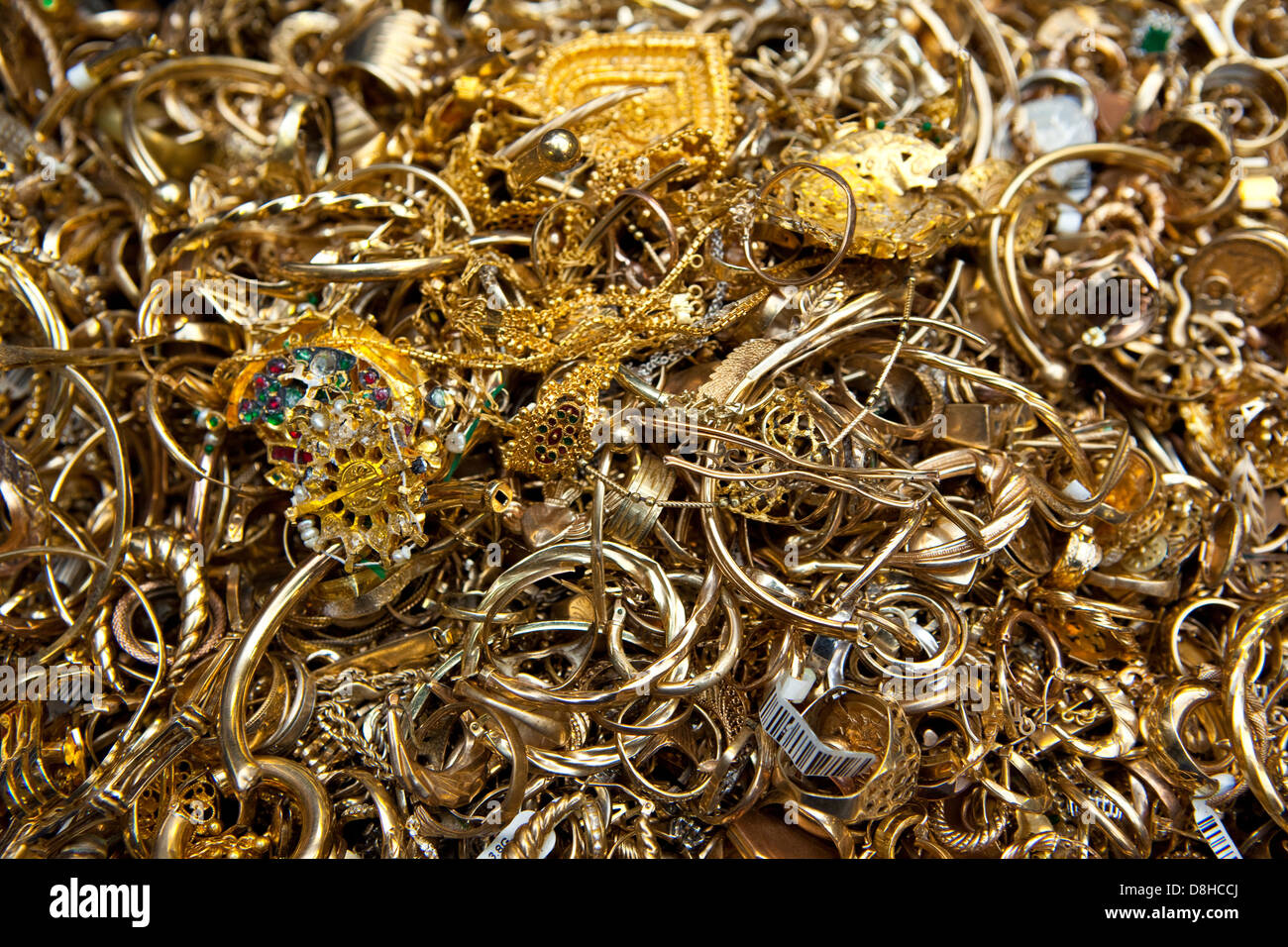 Recycling scrap gold to make a molten gold bar at the London Assay Office in Gutter Lane Photo Credit: David Levenson Stock Photo