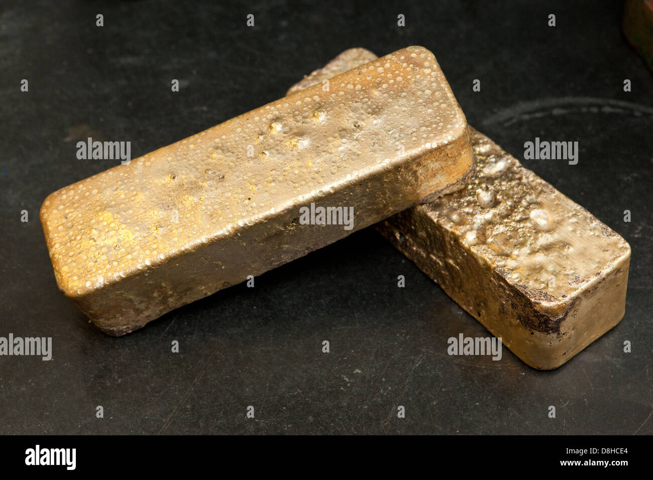 Molten gold bar made from recycled scrap gold at the London Assay Office in Gutter Lane Photo Credit: David Levenson Stock Photo