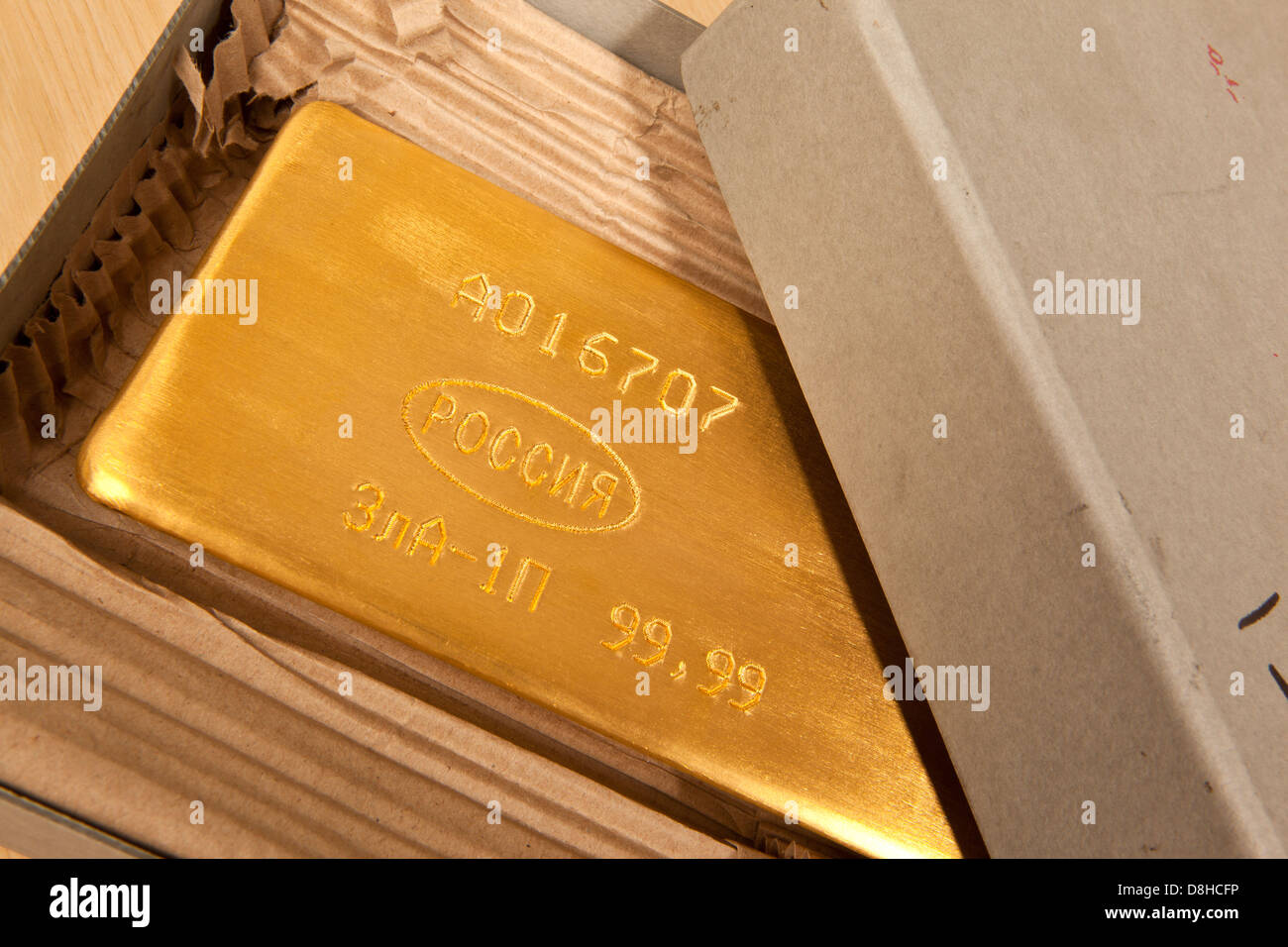 Gold bar ingot in Hatton Garden Gold Dealer London England Photo Credit: David Levenson Stock Photo