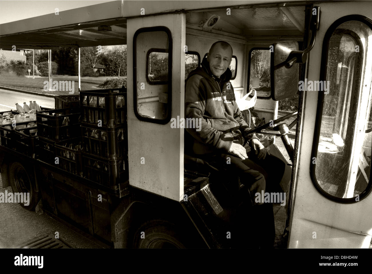 A traditional British electric milkfloat vehicle Stock Photo