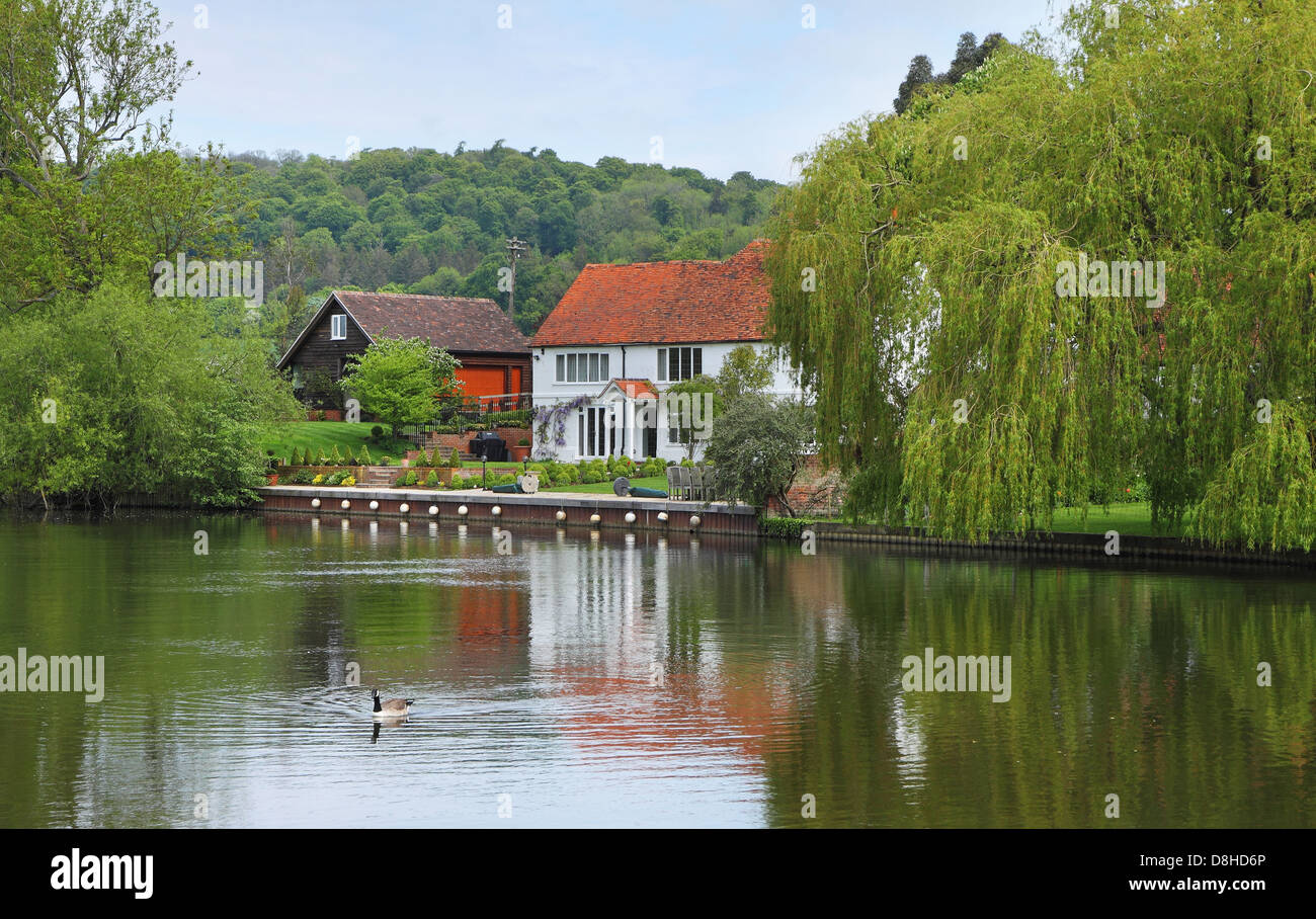 House on the Banks of the River Thames in England Stock Photo