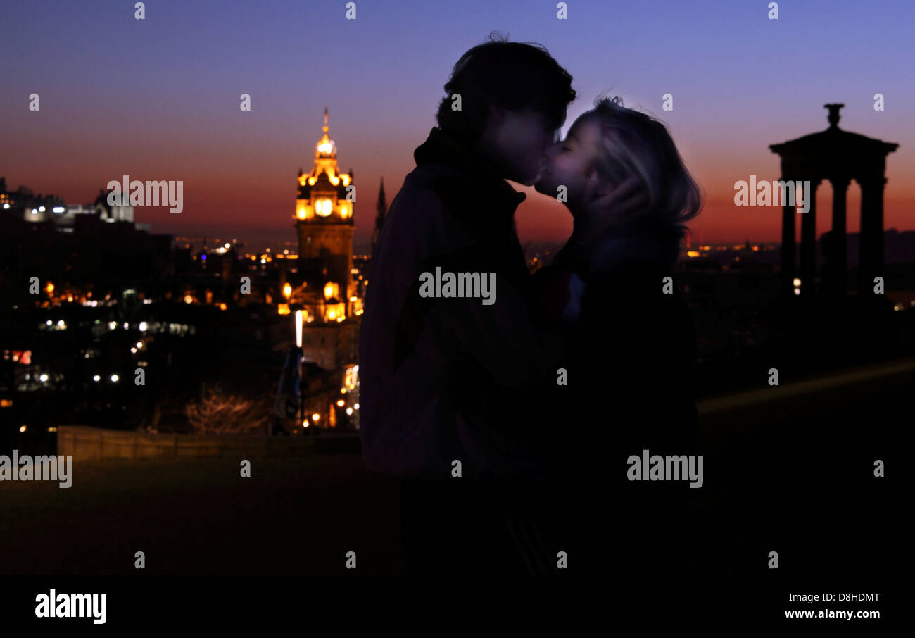 Lovers kissing Carlton Hill Edinburgh Dusk Stock Photo