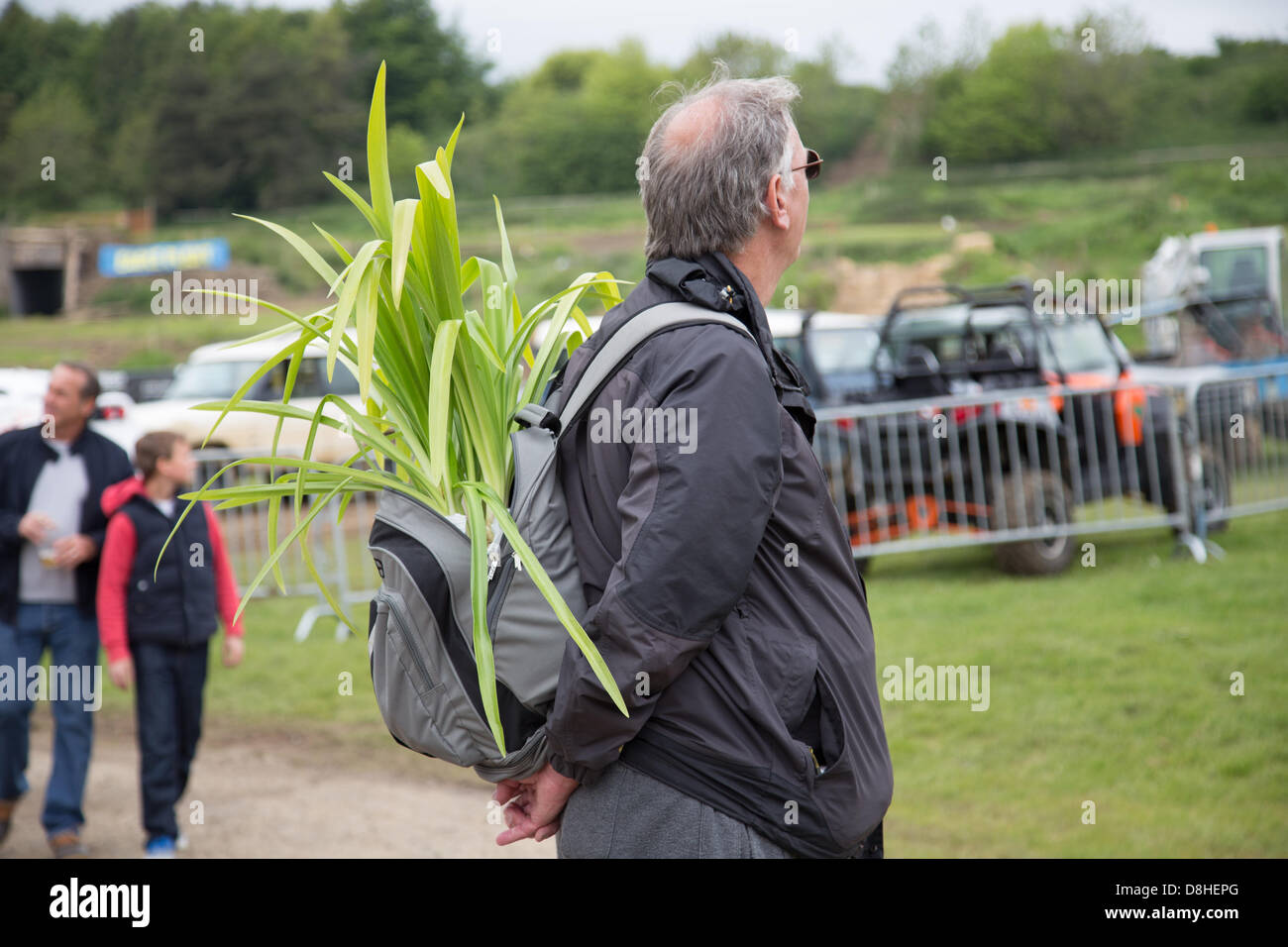 Shepton Mallet, Somerset, UK. 28th May 2013. Man with plant in his backpack. This year celebrates the 150th Bath & West Show. Credit:  Ed Stone/Alamy Live News Stock Photo