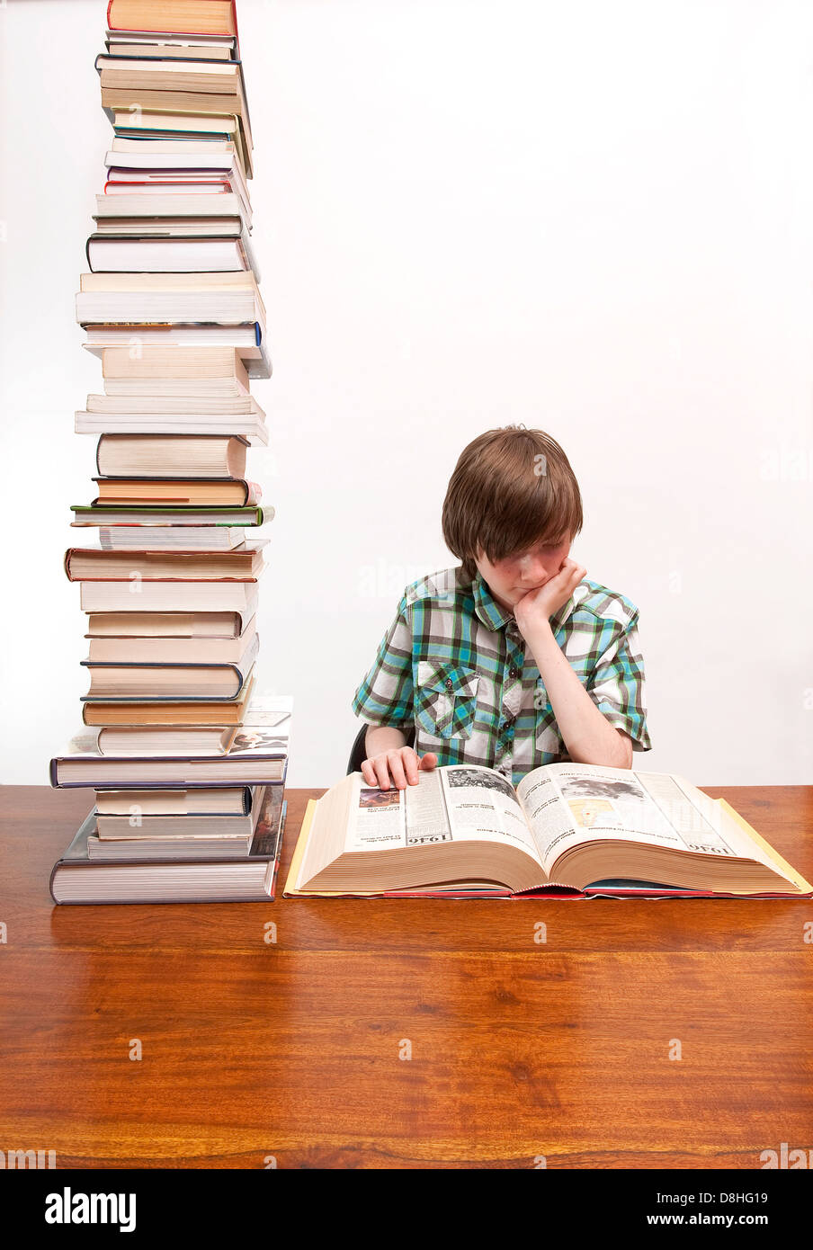 young male boy doing homework Stock Photo