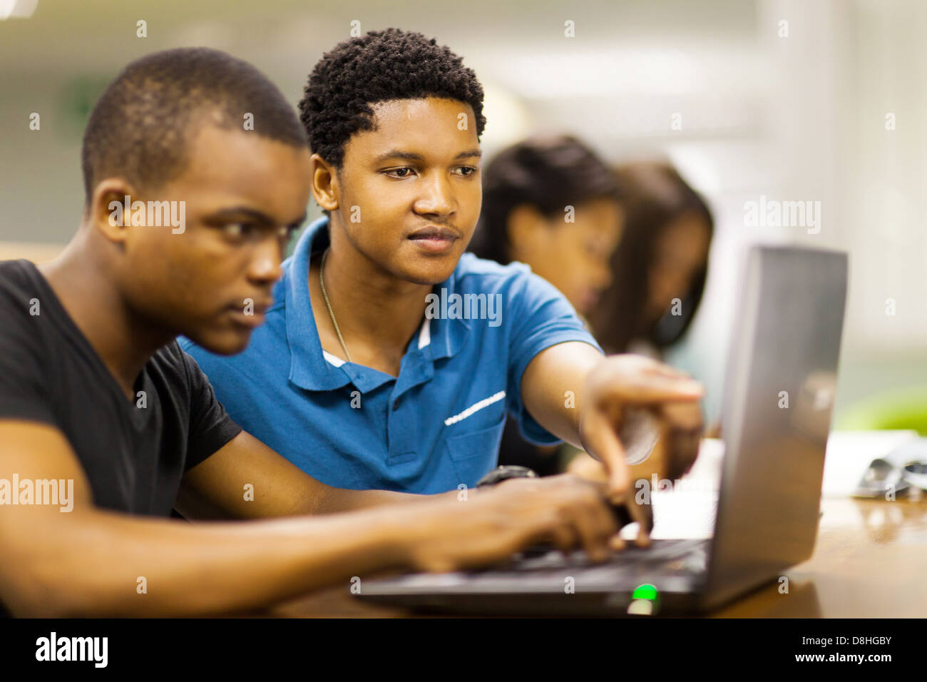 african college students using laptop together Stock Photo - Alamy