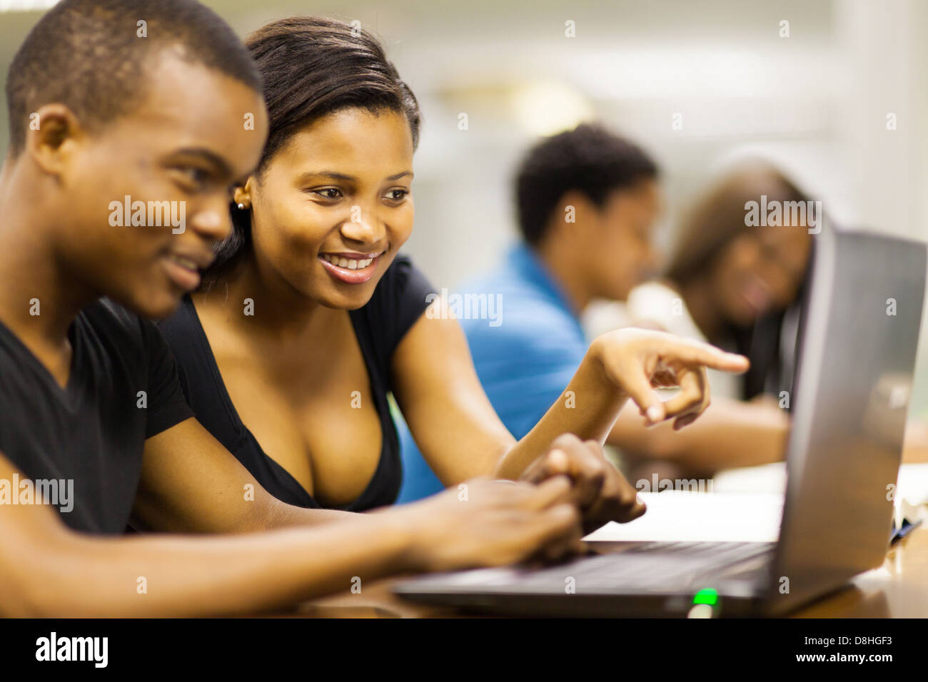 african american college students using laptop computer Stock Photo - Alamy