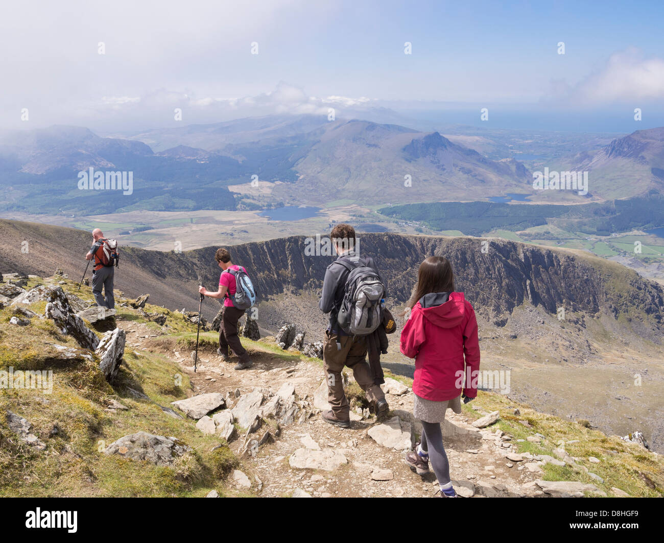 View south to Llechog from Rhyd Ddu path on Bwlch Main on Mt Snowdon with walkers walking down in Snowdonia, North Wales, UK Stock Photo