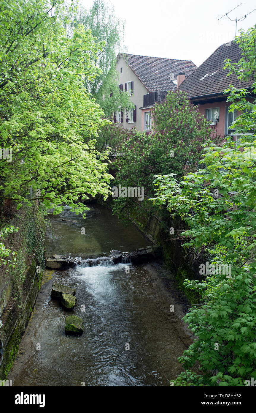 River runs through town houses Stock Photo