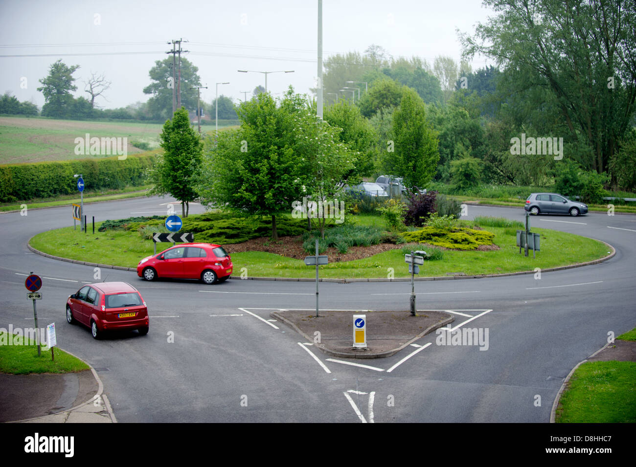 Cars going around a roundabout Stock Photo Alamy