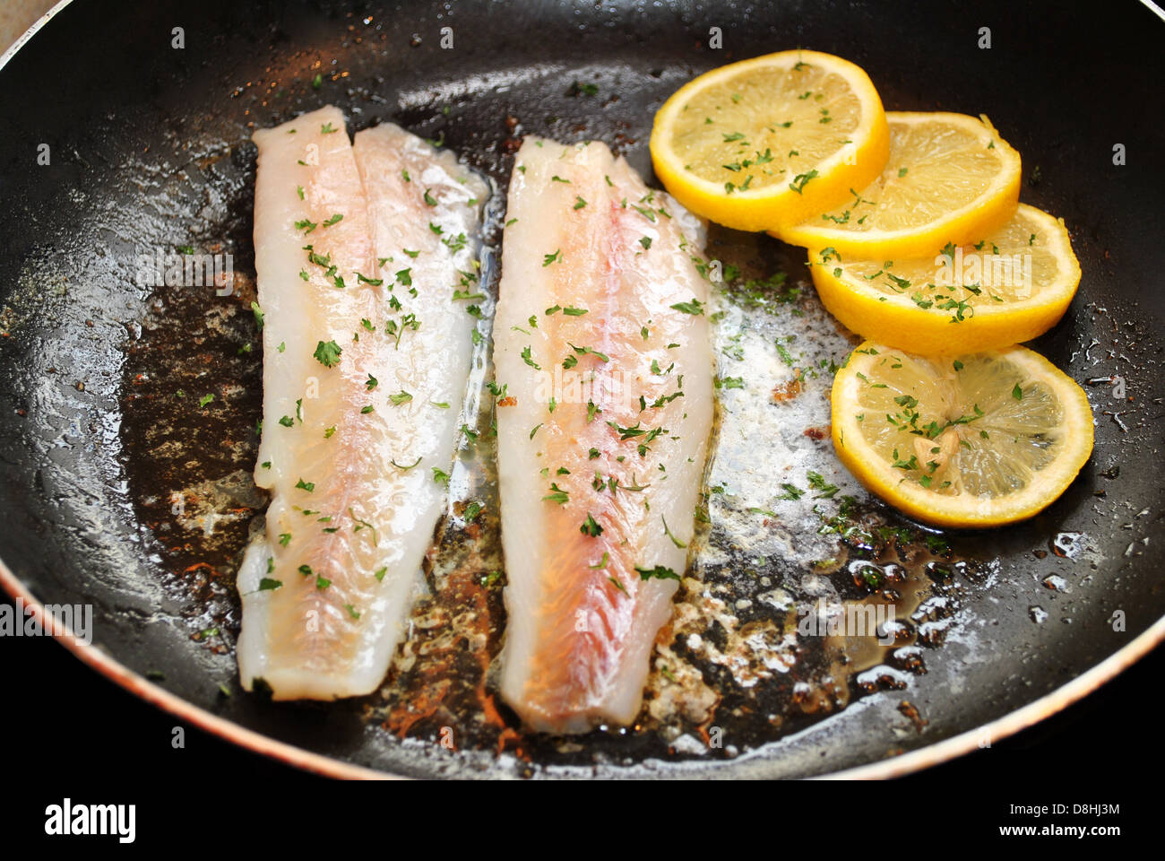 Cooking Fish for a Healthy Dinner Stock Photo - Alamy