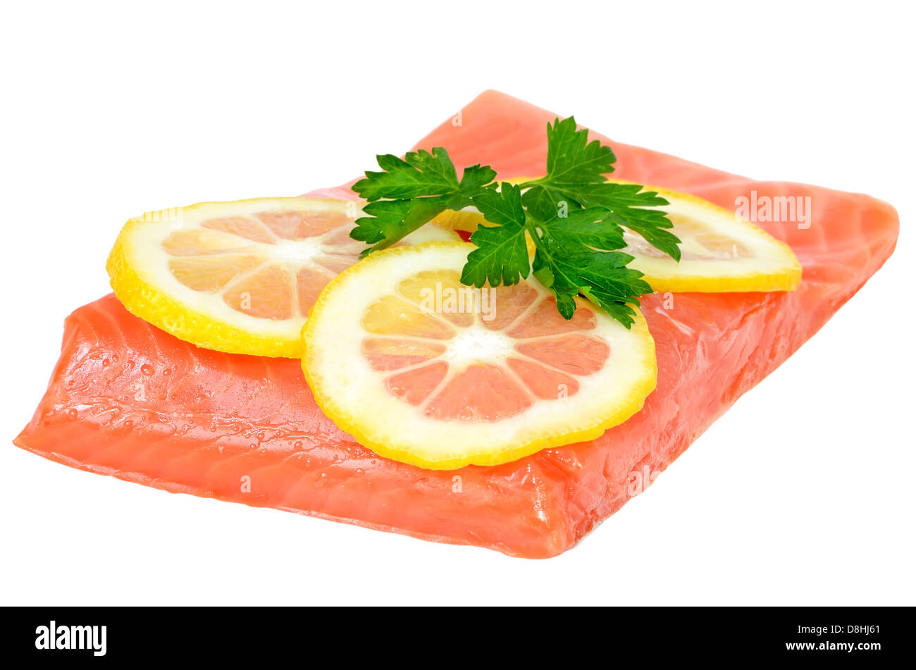 Salmon fillet and lemon slices isolated on white background Stock Photo